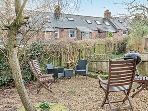 A patio with outdoor furniture, a grill, and a view of a brick house. - 3 Bed in Ripon (oc-94477) (Ripon)