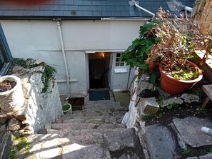 A stone staircase leading to a white building with a dark roof. - 2 Bed in Brixham (oc-bx087) (Brixham)