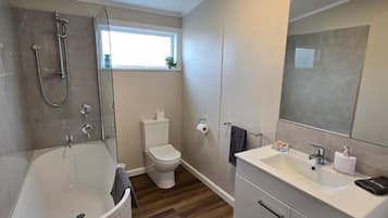 Superior Suite, Patio | Bathroom | Hair dryer, towels