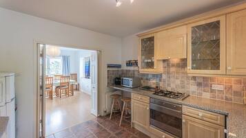 Oven, dishwasher, high chair, cookware/dishes/utensils