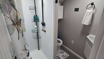 Shower, hair dryer, towels, shampoo