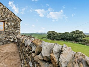 A stone house with a view of rolling green hills and trees. - 2 Bed in Ulverston (oc-93091) (Osmotherley)