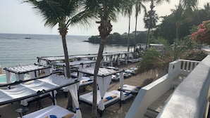 A beachside hotel with rows of sunbeds, a pool, and a view of the sea. - Royal Villa 4-bedroom Villa-January 15, 2027-January 22, 2027 (Cofresi)