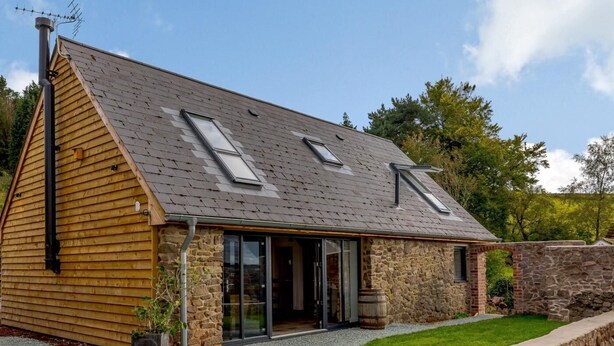 A house with a sloped roof, stone walls, and a gravel driveway. - 3 Bed in Ratlinghope (oc-79238) (Ratlinghope)