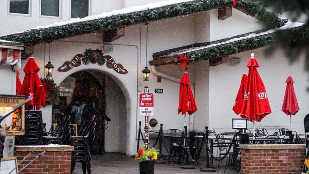 A restaurant with outdoor seating, a sign prohibiting pets, and a Christmas wreath. - Studio - Ski In/Ski Out Vail Village 204 (Vail)