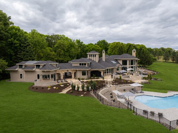 Exterior - Overlook Retreat Manor is a luxury private estate on 100 scenic acres for up to 24 guests. Enjoy the pool, hot tub, game room, sports court, and breathtaking sunset views. The kind of place people talk about long after they leave. (Sinking Spring)