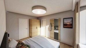 A modern bedroom with a bed, wardrobe, and a large mirror. - Apartement with lake view (Unterburg am Klopeiner See)
