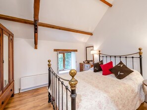 A bedroom with a bed, a nightstand, a dresser, a window, and a radiator. - 5 Bed in Torrington (oc-knawo) (Frithelstock)