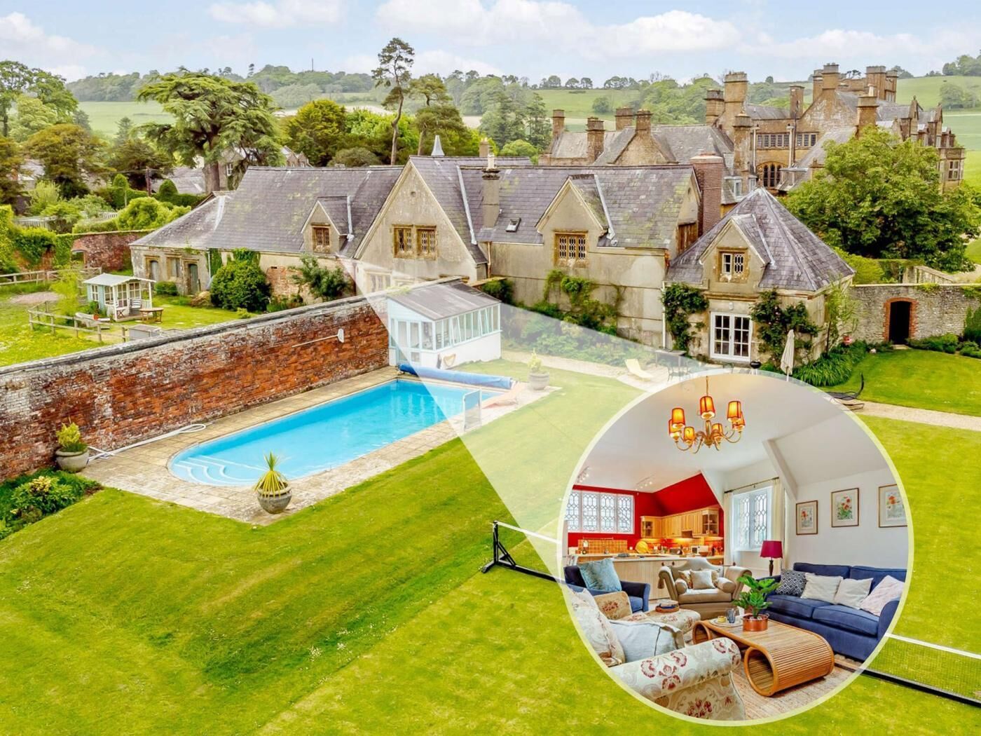 A large estate with a swimming pool, a well-maintained lawn, and a view of the surrounding countryside.