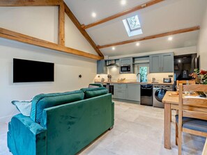 A modern kitchen with grey cabinets, a microwave, and a dishwasher. - 1 Bed in Kirkby Stephen (oc-95629) (Ravenstonedale)
