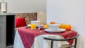 A breakfast table with orange juice, eggs, croissants, and a bowl. - 1 Bed in Pickering (oc-96309) (Allerston)