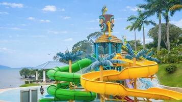 A water park with multiple slides and a pool area.