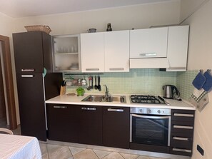 Fridge, oven, cookware/dishes/utensils - Beach House with a Garden in Porto Frailis (Porto Frailis)