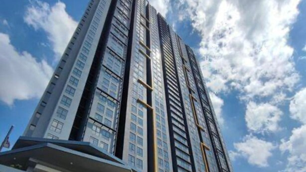 A high-rise building with multiple floors, large windows, and a modern architectural design. - Cozy 2-bedroom apartment near KLCC, TRX, Gleneagles Hospital (Kuala Lumpur)