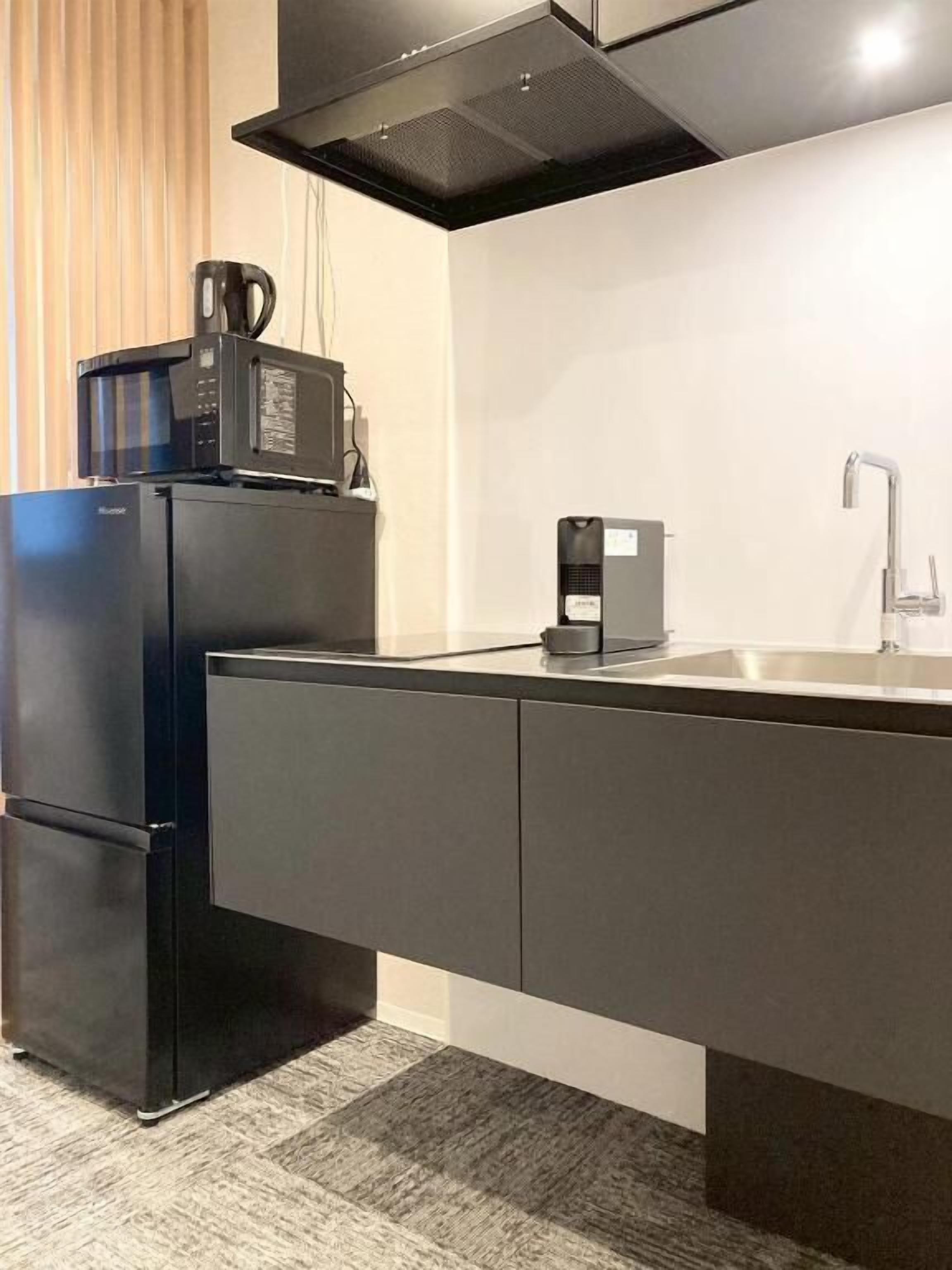 Duplex, 2 Bedrooms, Balcony | Private kitchen | Stovetop, cookware/dishes/utensils, cleaning supplies, freezer