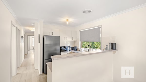 Coffee/tea maker, fridge, microwave, oven