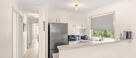 Coffee/tea maker, fridge, microwave, oven