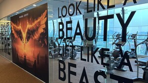 A gym with exercise equipment and a motivational poster. - Cozy studio apartment with balcony near KLCC, TRX, Gleneagles, Ampg Puteri Hosp (Kuala Lumpur)