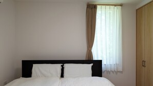 A bedroom with a bed, a window with curtains, and a wardrobe. - Fuyu no Sonata 2 (Nakafurano)