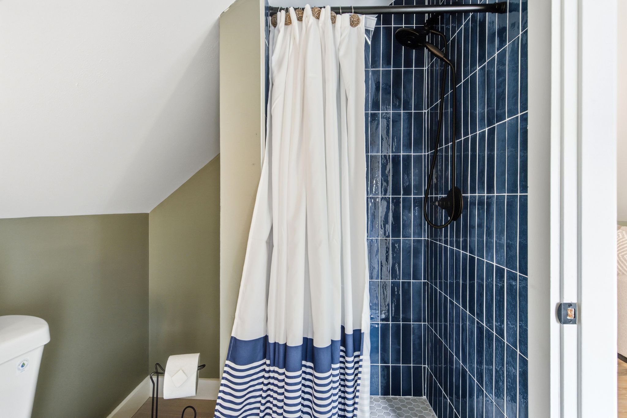 Shower, hair dryer, towels, toilet paper
