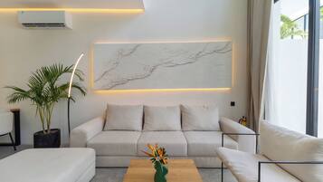 Deluxe Apartment, 1 Bedroom, Pool View | Living area | 42-inch Smart TV with cable channels