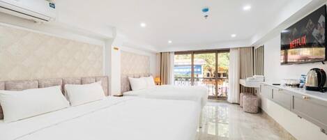 Family Room, Courtyard View | In-room safe, desk, laptop workspace, blackout drapes
