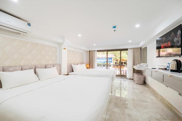 Family Room, Courtyard View | In-room safe, desk, laptop workspace, blackout drapes - Hanoi Serenity Hotel (Hoan Kiem)