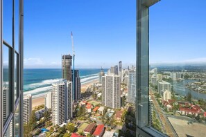 A high-rise building with a view of the beach and ocean. - level 32 Skyline Serenity in Surfers Paradise Q1 (Surfers Paradise)