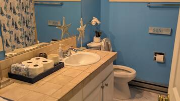 Hair dryer, towels, soap, toilet paper