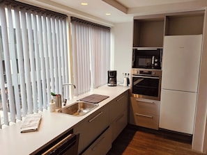 Coffee/tea maker, fridge, stovetop, high chair - City-Center Gem with Prime Reykjavík Access (Reykjavík)