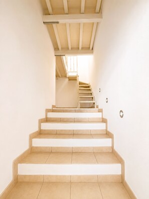 A staircase leading to an upper floor with a skylight above. - Casa Arcobaleno a Rio Marina (Rio Marina)