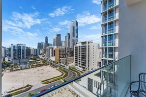 A high-rise building with a modern architectural design, featuring multiple balconies and large windows. - Premium Studio l near Museum of Future and Metro (Al Satwa)