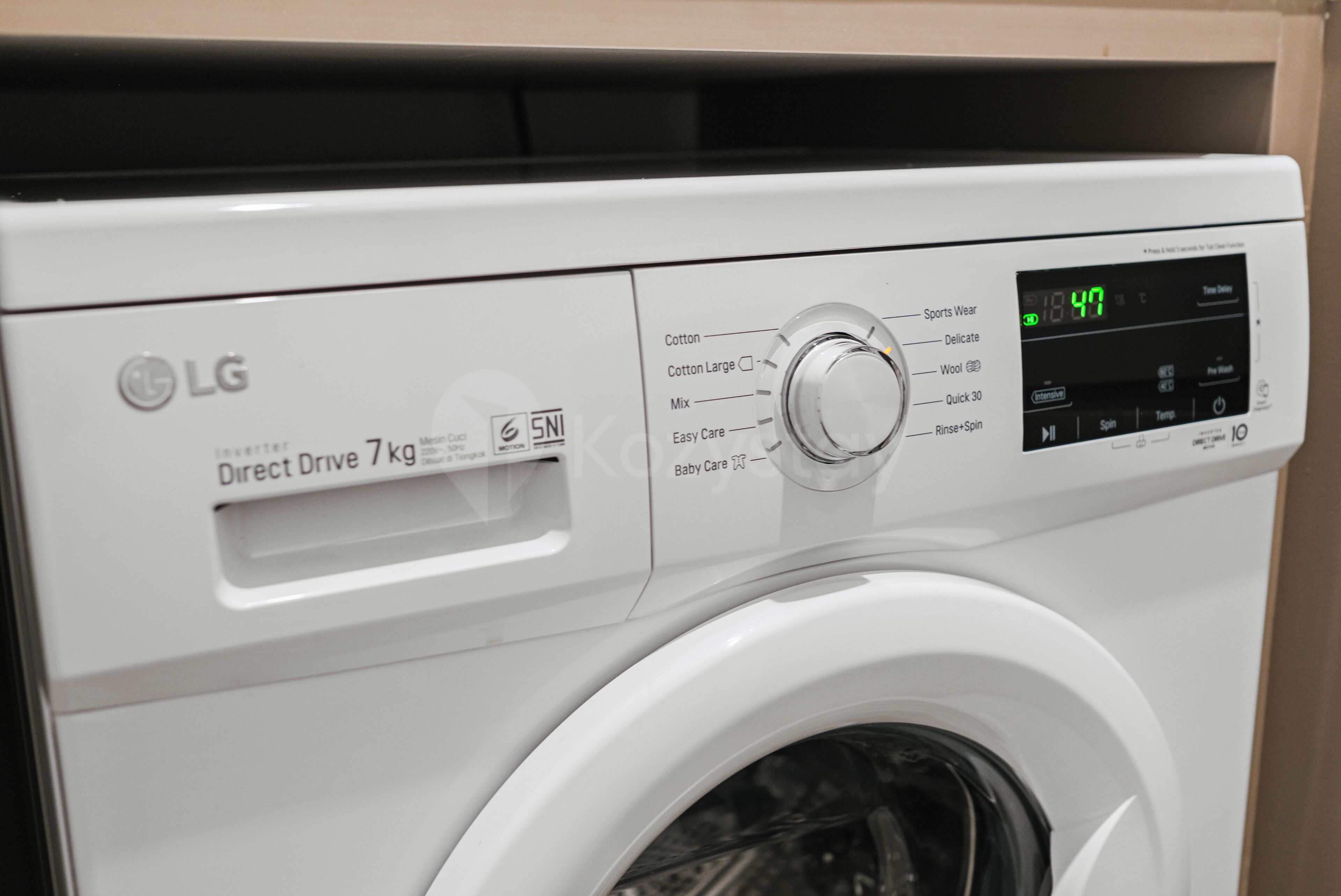 A white LG Direct Drive 7 kg washing machine with a digital display.