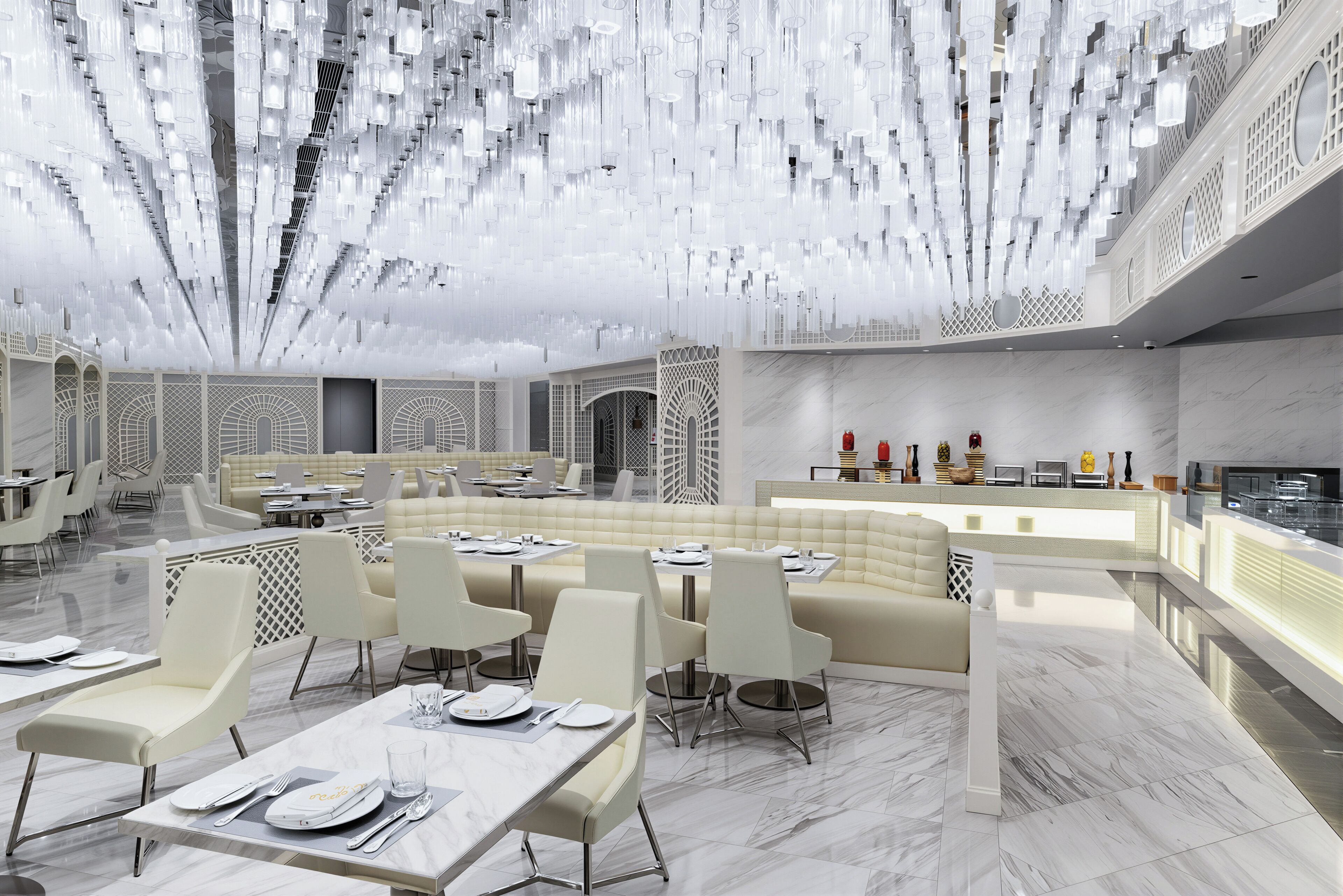 A modern restaurant with high ceilings, hanging light fixtures, and a central seating area with tables and chairs.