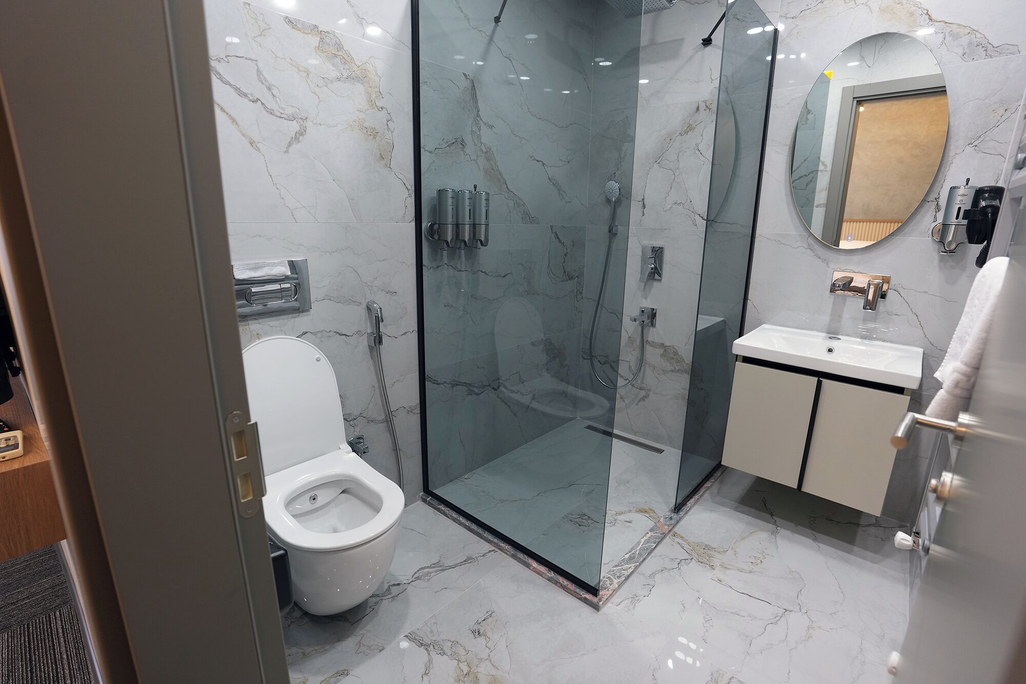 Shower, hair dryer, towels, soap