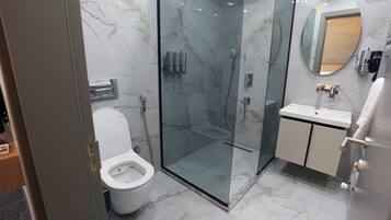 Shower, hair dryer, towels, soap