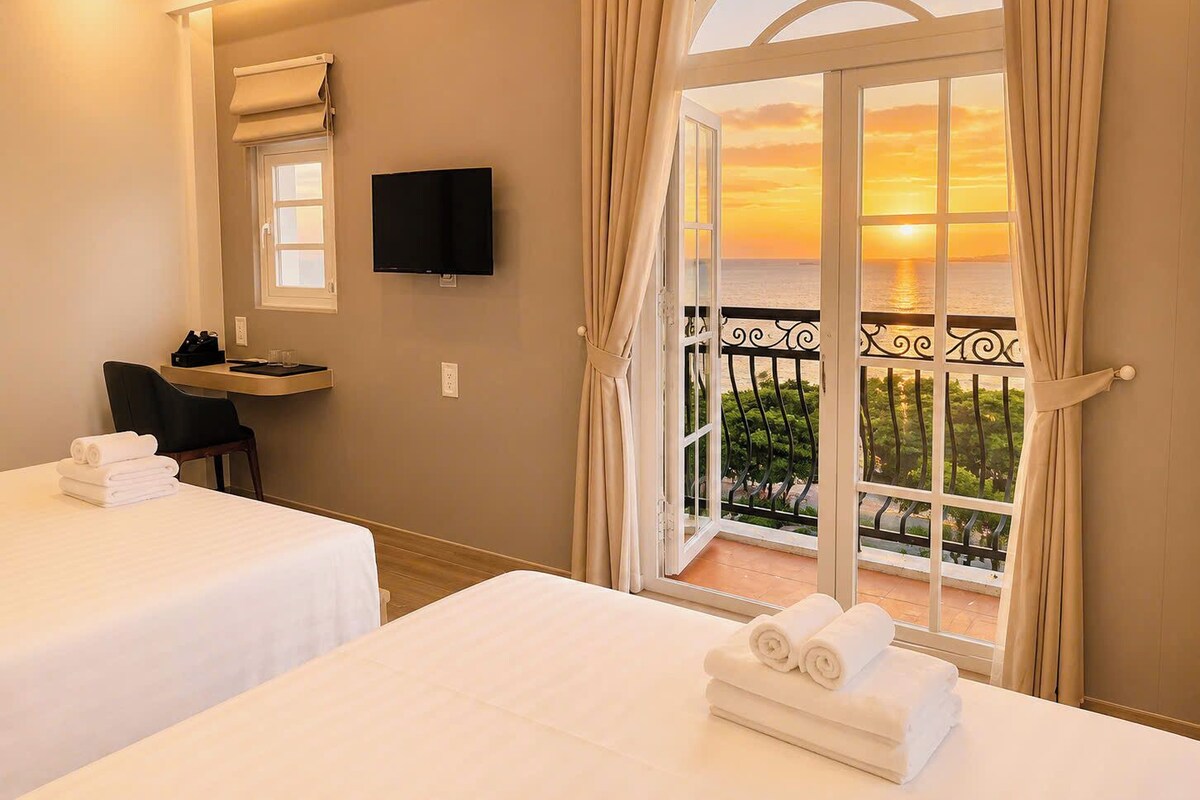 Deluxe Triple Room, Beach View | Laptop workspace, free WiFi