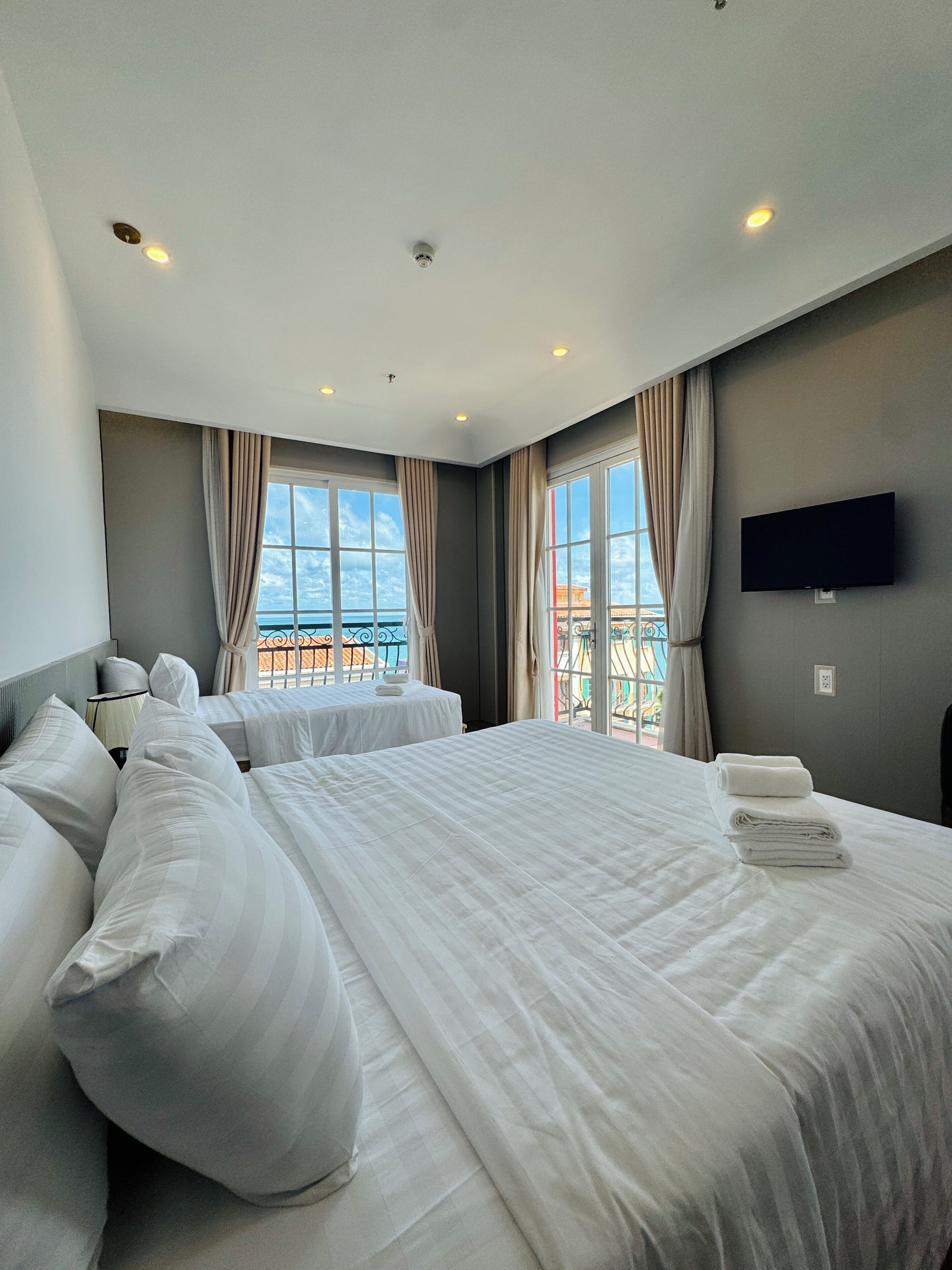 Deluxe Triple Room, Beach View | Laptop workspace, free WiFi