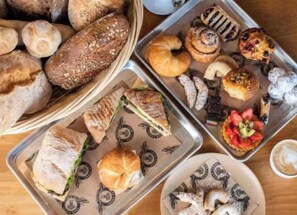 A variety of baked goods including bread, pastries, and sandwiches. - ✨Deluxe Designer Two Bedroom Apartment at Fort Lauderdale (Fort Lauderdale)