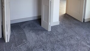 A room with a grey carpet, a white wardrobe, and a white door. - Chic Riverwalk Facing Condo Pool View  Free Parking Pets Welcome (San Antonio)