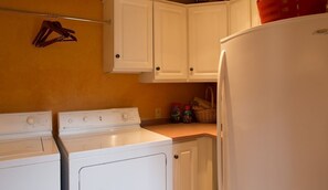 A kitchen with a stove, oven, and refrigerator. - Mi Casa - Monterey Home - Del Monte Golf Course Frontage (Monterey)