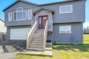 A two-story house with a front entrance, a staircase, and a garage. - 3 Mi to Alaska Zoo! Anchorage Adventure Basecamp (Anchorage)