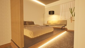 A modern bedroom with a bed, bench, and bedside lamp. - Giraffe Nakasu haku (Fukuoka)