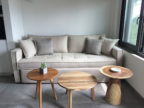 One-Bedroom Apartment Upper Floor Partial Sea View | Living area | 43-inch Smart TV with digital channels - Elsa Modern Apartments (Pogonia)