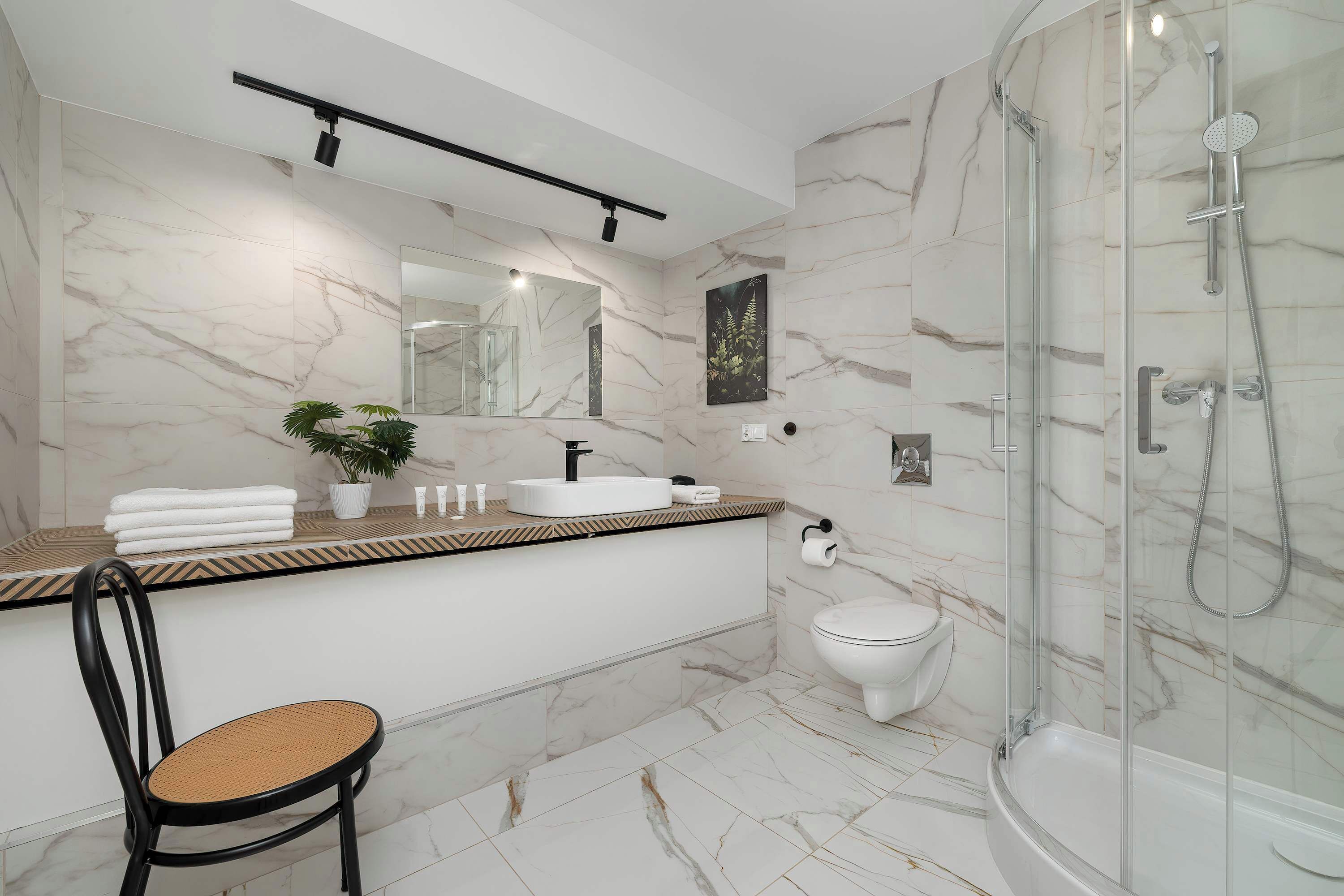 Shower, hair dryer, towels, shampoo