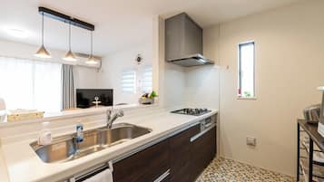 Fridge, cookware/dishes/utensils, dining tables