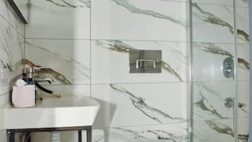 Eco-friendly toiletries, hair dryer, slippers, towels