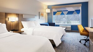 A hotel room with two beds, a desk, a chair, a window with a view, and a wall-mounted lamp. - Holiday Inn Express Knoxville Airport Alcoa by IHG (Alcoa)