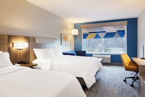 A hotel room with two beds, a desk, a chair, a window with a view, and a wall-mounted lamp. - Holiday Inn Express Knoxville Airport Alcoa by IHG (Alcoa)