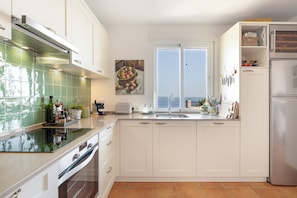 Coffee/tea maker, fridge, microwave, oven